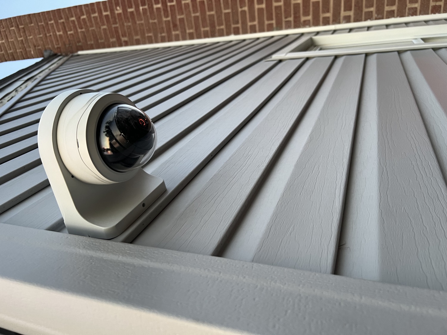A dome camera installed on a home by NJS