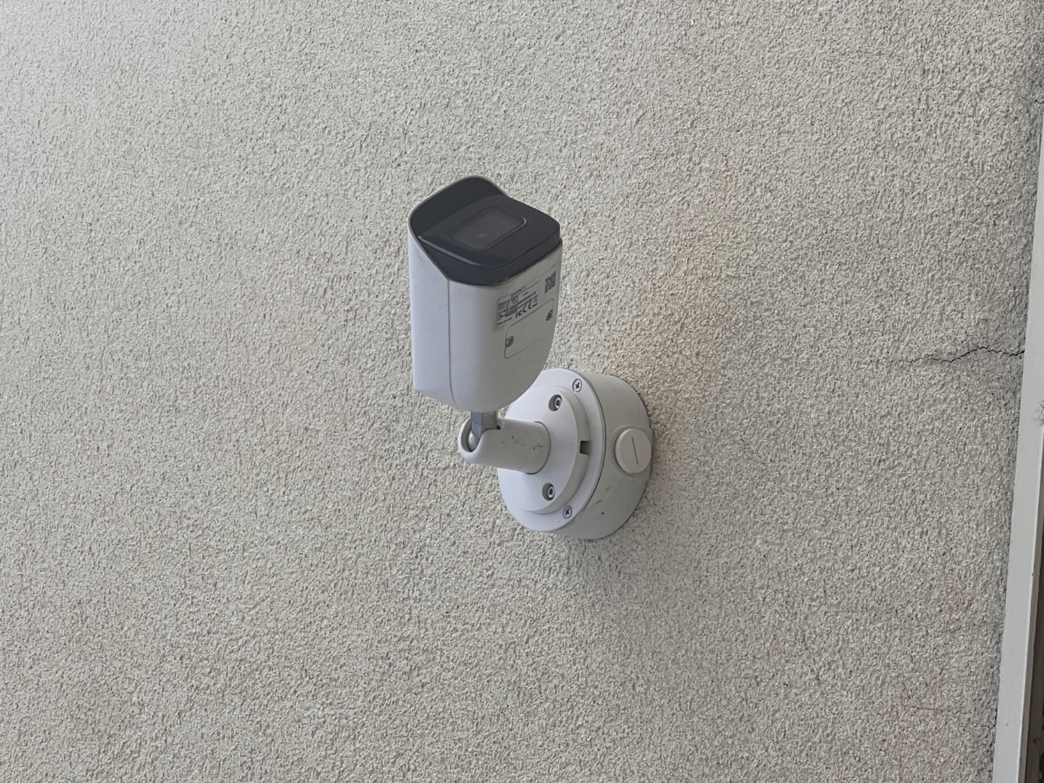 A camera installed on a building exterior by NJS